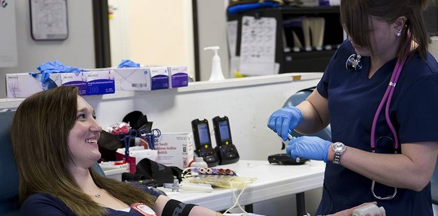 A blood donor and a nurse.